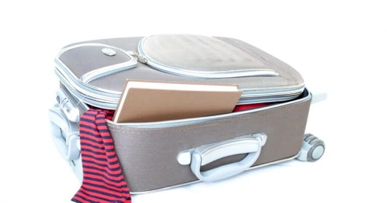 Open suitcase packed for an extended stay