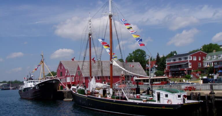 Lunenburg waterfront with red Fisheries Museum buildings and a docked schooner