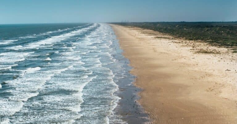 Long sandy Atlantic beach with rolling surf on Nova Scotia's South Shore